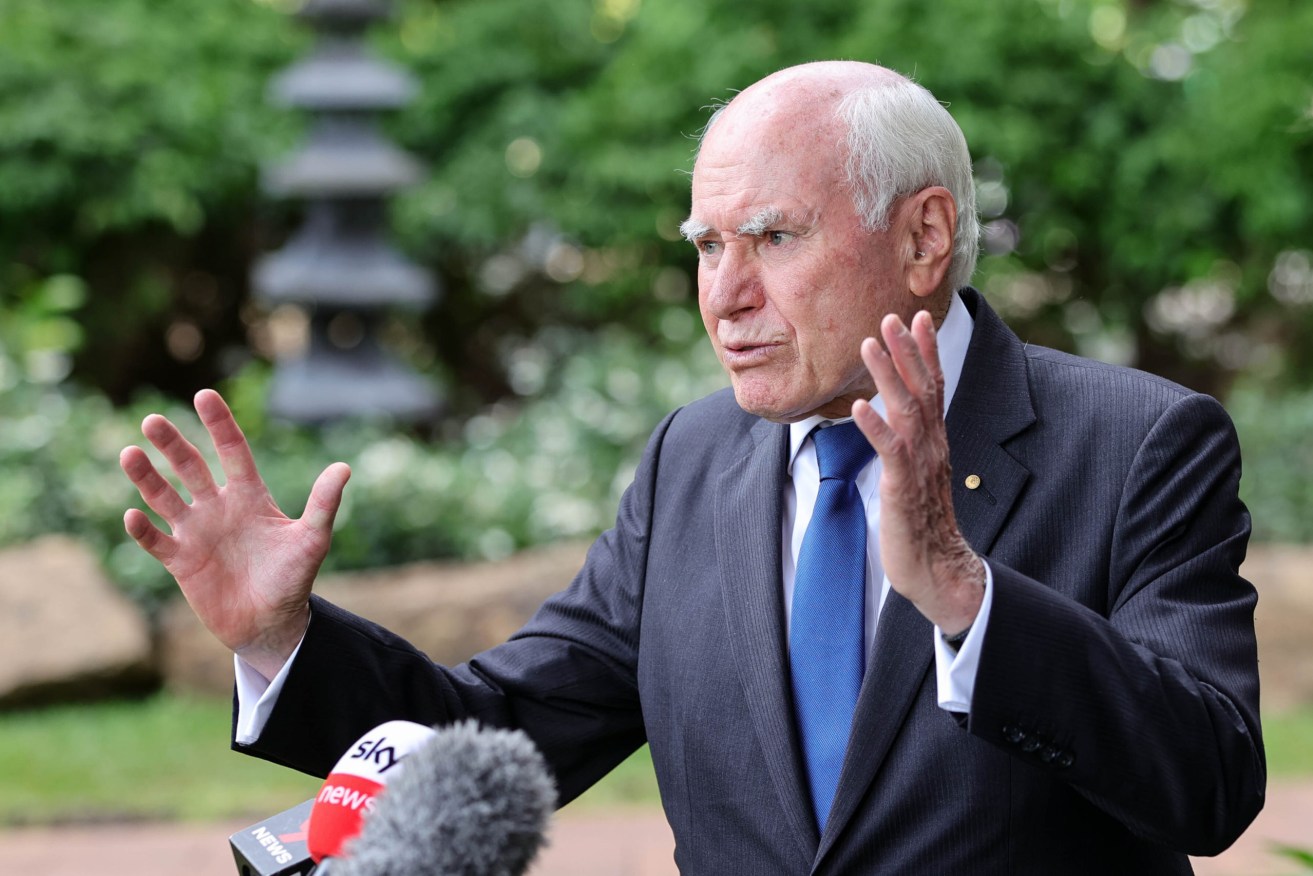 Former prime minister John Howard addresses the media at a press conference during a visit to Brookfield Gardens in Brisbane. (AAP Image/Russell Freeman)