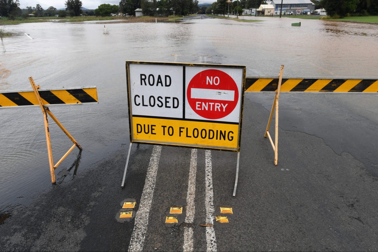 Floodwaters are seen in the town of Grantham, west of Brisbane. Queensland continues to be battered by an unseasonal rain band.  (AAP Image/Darren England) 