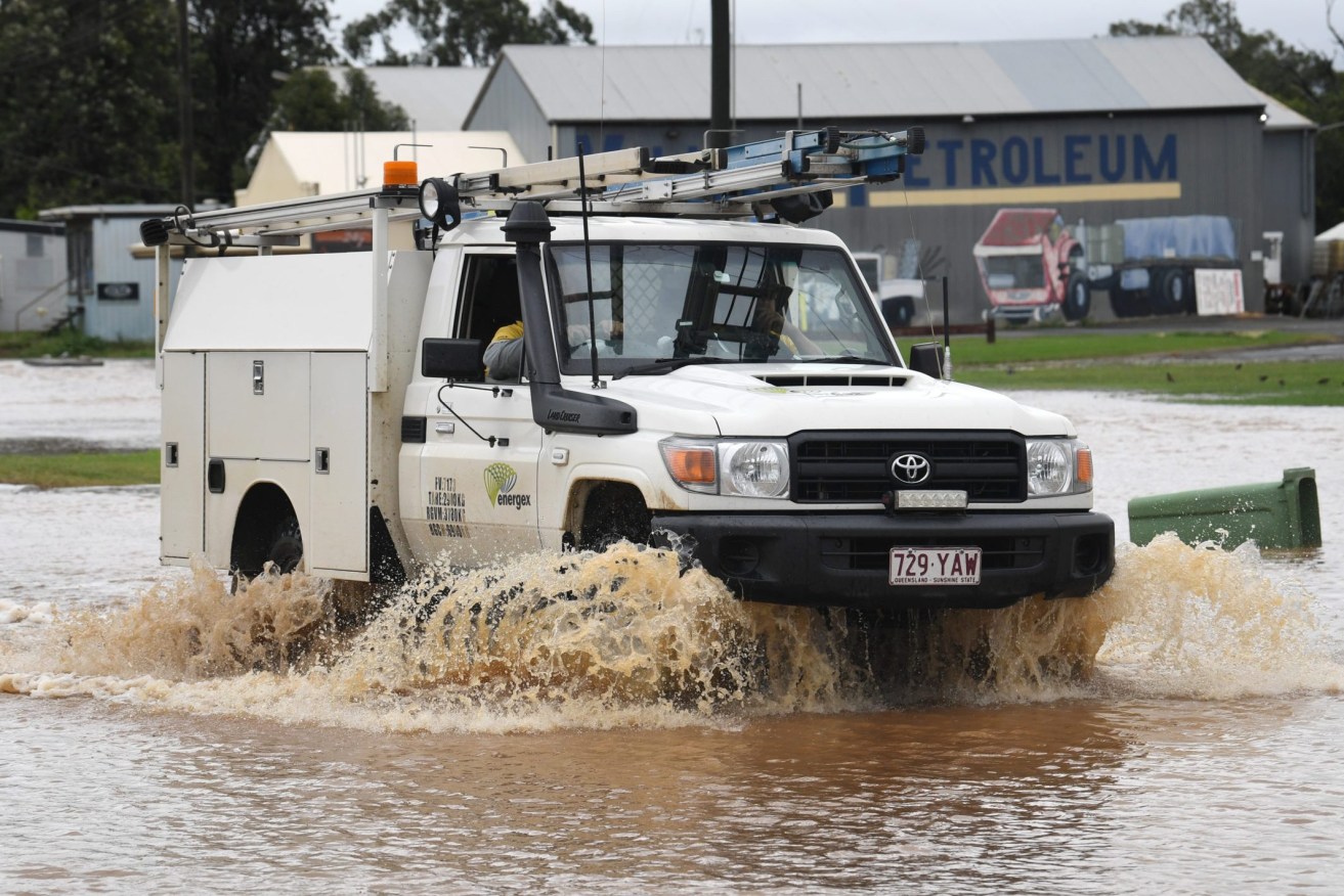 At least three North Queensland towns are on alert for flash flooding as "intense" rainfall is predicted. (AAP Image/Darren England) 