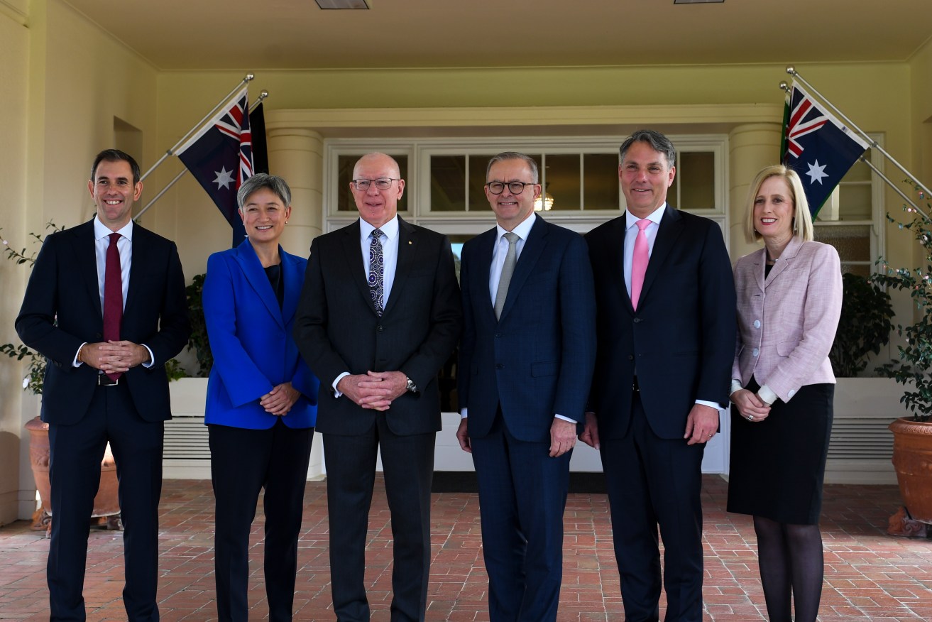 Australian Governor-General David Hurley and Australian Prime Minister Anthony Albanese pose for photographs with interim ministers Penny Wong, Jim Chalmers, Richard Marles and Katy Gallagher after a swearing-in ceremony at Government House in Canberra, Monday, May 23, 2022. (AAP Image/Lukas Coch) 