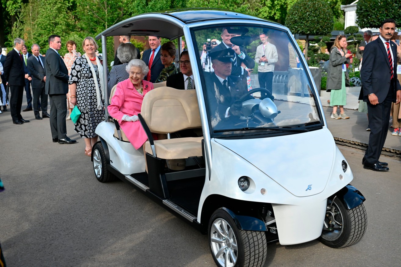 Britain's Queen Elizabeth II sits in a buggy during a visit by members of the royal family to the RHS Chelsea Flower Show 2022, at the Royal Hospital Chelsea, in London, Monday, May 23, 2022. (Paul Grover/Pool photo via AP)