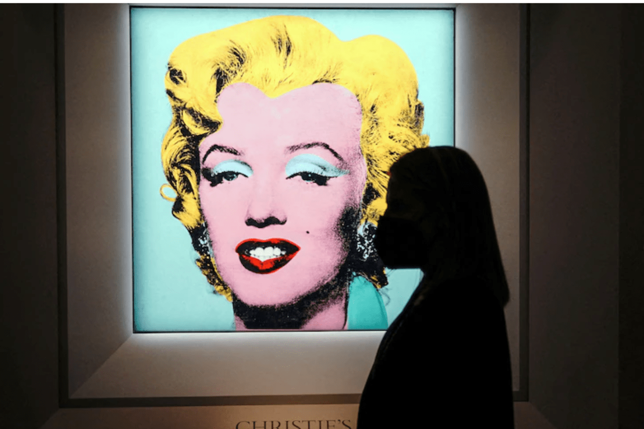 Andy Warhol's "Shot Sage Blue Marilyn" sold for less than was estimated before the auction.(Reuters: Carlo Allegri)