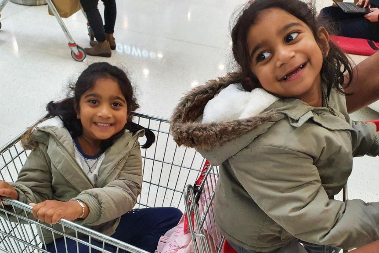 Kopika Murugappan, left, will spend her seventh birthday in community detention with sister Tharnicaa. (Image: supplied)