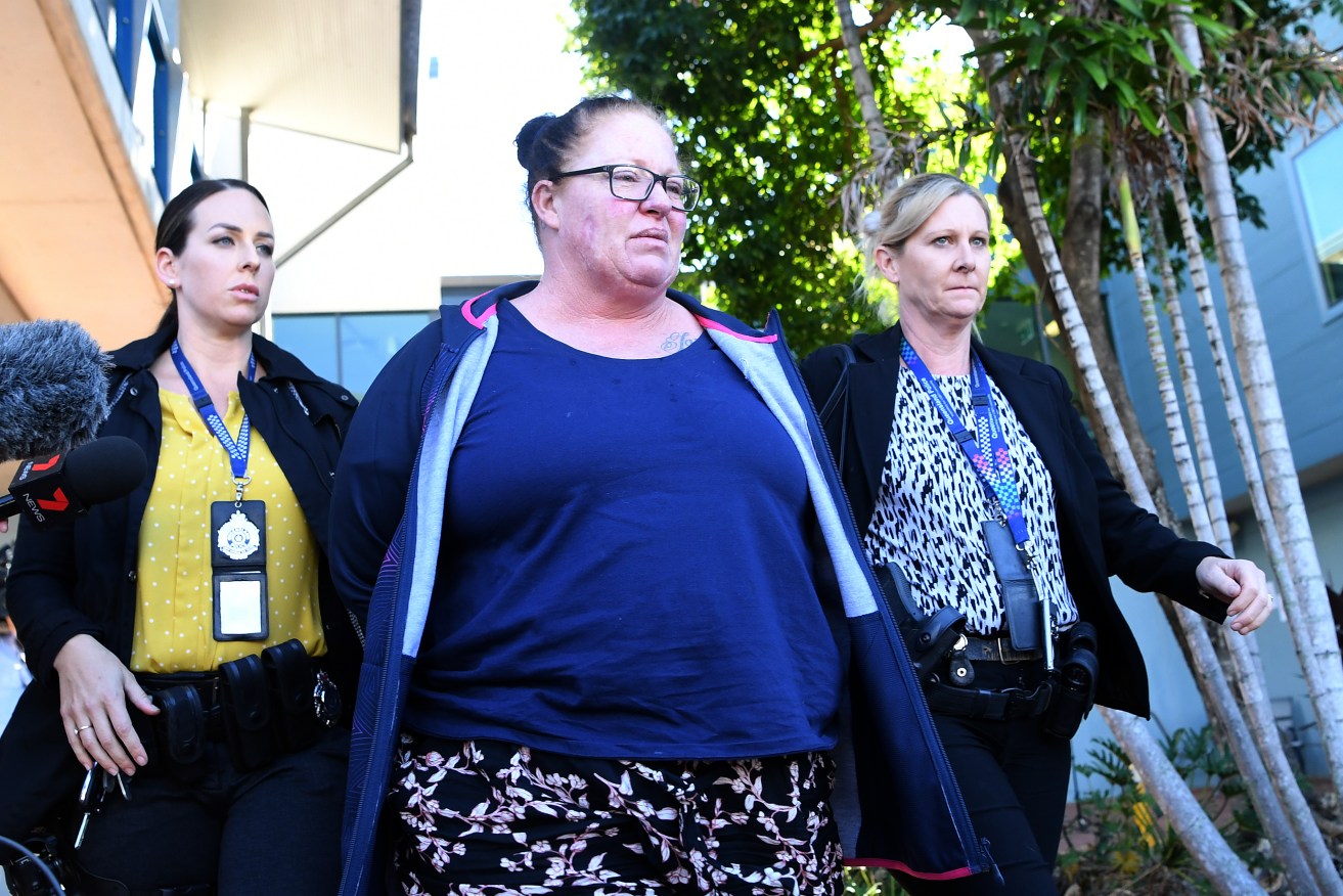 Shannon White (centre) is taken from the Morningside police station after she was arrested in Brisbane, Wednesday, June 3, 2020. Ms White has been charged with the murder of her four-year-old stepdaughter Willow Dunn. (AAP Image/Dan Peled) 