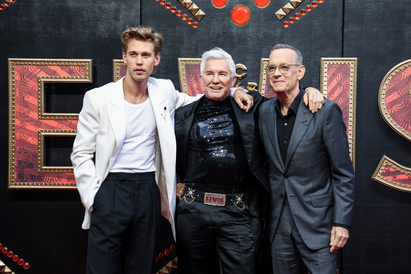 Austin Butler, from left, director Baz Luhrmann, and Tom Hanks pose for photographers upon arrival for the premiere of the film 'Elvis' in London Tuesday, May 31, 2022. (Photo by Vianney Le Caer/Invision/AP)