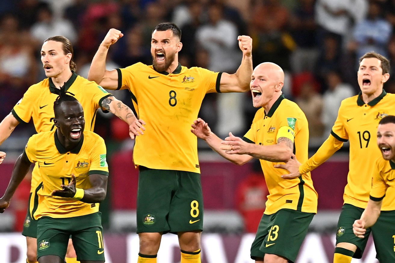 Australia's Socceroos celebrate after winning the penalty shootout of the FIFA World Cup 2022 Intercontinental playoff qualifying soccer match against  (EPA/Noushad Thekkayil)