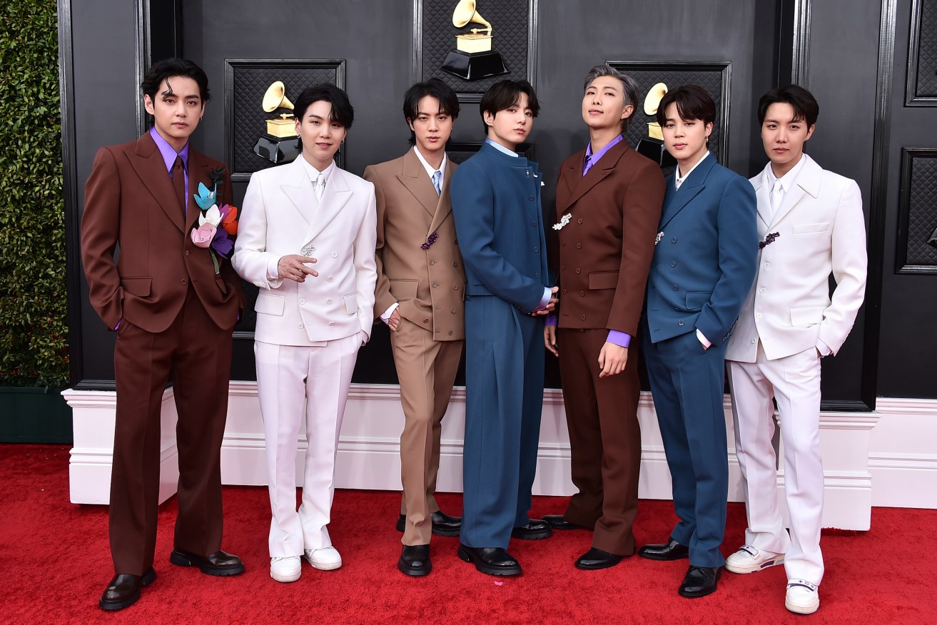 BTS arrives at the 64th Annual Grammy Awards on April 3, 2022, in Las Vegas. The seven-member group with hits like “Butter” and “Dynamite” says they are taking time to focus on solo projects.  (Photo by Jordan Strauss/Invision/AP, File)