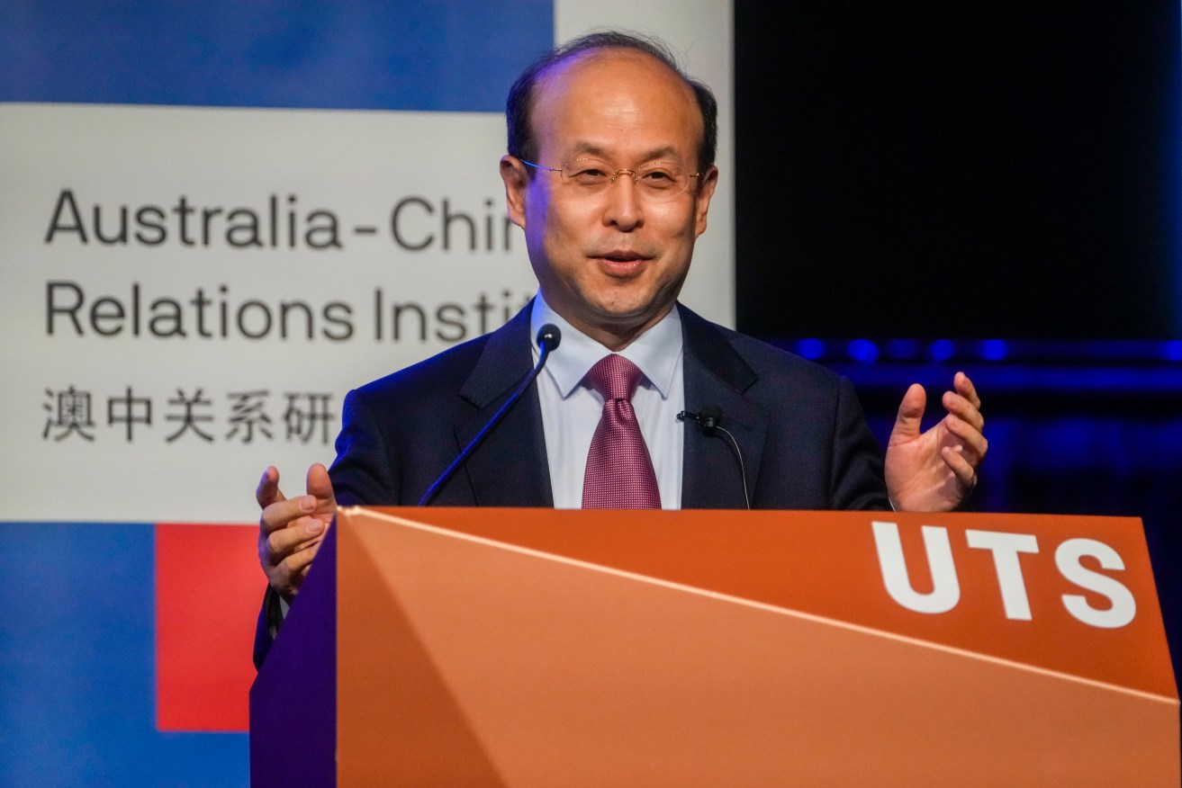 China's Ambassador to Australia, Xiao Qian gestures during his address on the state of relations between Australia and China at the University of Technology in Sydney,Australia, Friday.(AP Photo/Mark Baker)