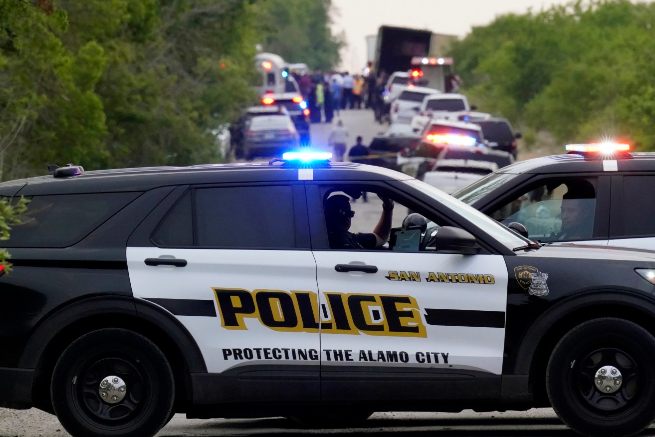 Police block the scene where a semitrailer with multiple dead bodies was discovered in San Antonio. (AP Photo/Eric Gay)