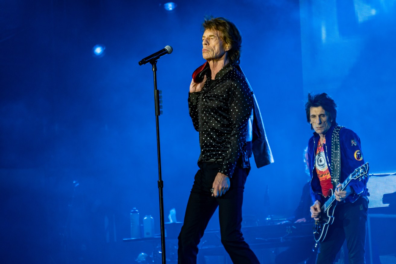 Mick Jagger and Ronnie Wood at a Rolling Stones concert in 2018. The band had to cancel a concert in Amsterdam this week after Jagger came down with Covid. (Image: Raph_PH)