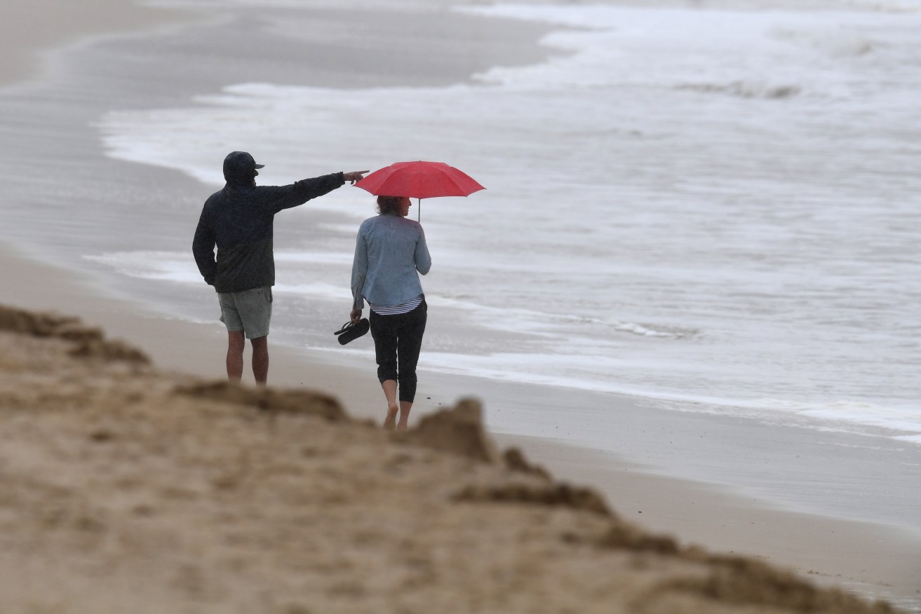 South-east Queensland coastal communities are being warned of strong winds and high seas as a major low-pressure system approaches coast. (AAP Image/Darren England) 