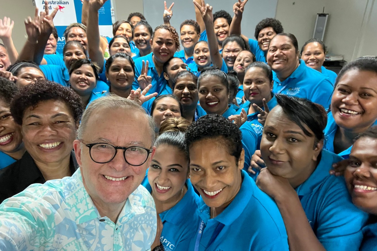 Prime Minister Anthony Albanese poses with some workers in Suva preparing to ease the skills shortage in aged care in Australia. (Supplied image)