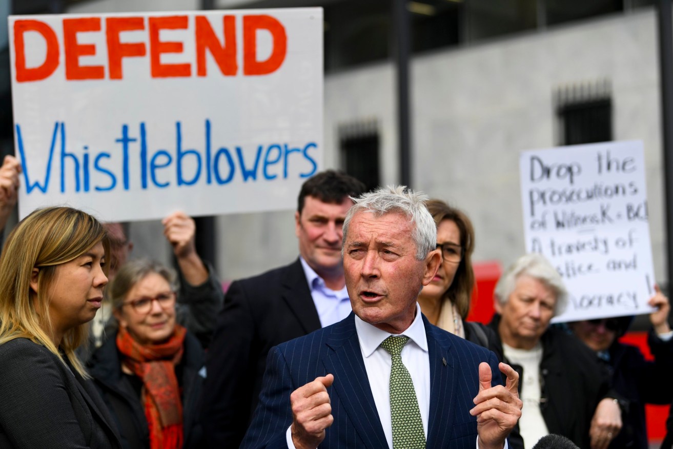 Lawyer Bernard Collaery addresses the media outside the Supreme Court in Canberra in 2019. (AAP Image/Lukas Coch) 