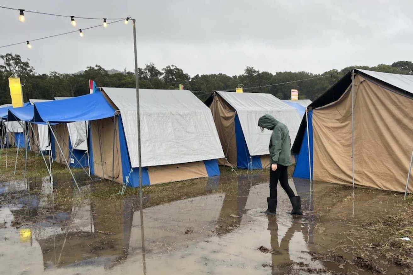 Splendour in the Grass festival goers are having to deal with wet, muddy conditions and soaked tents. (Image: Tobias Loftus/ABC News)