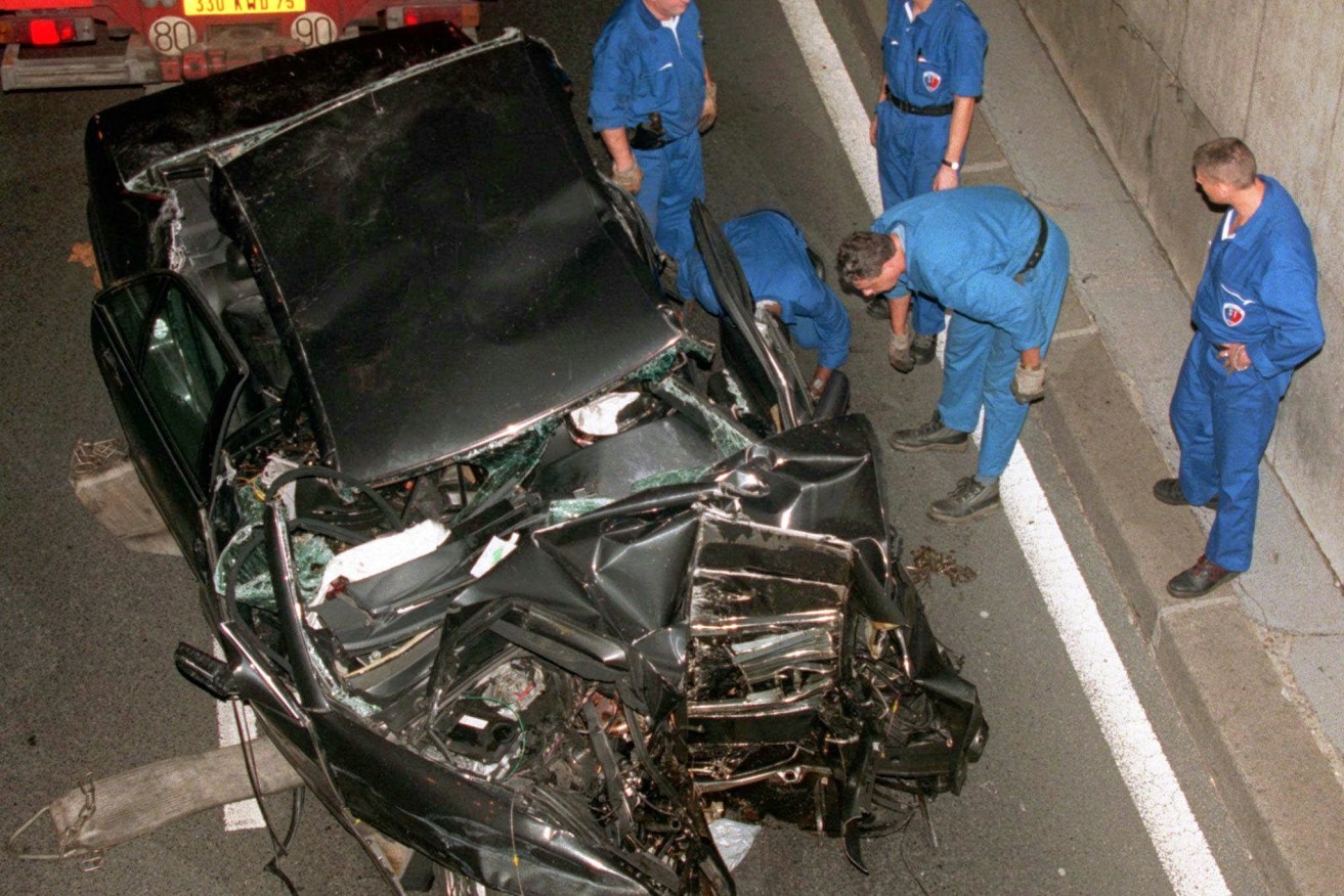 The badly damaged car in the Pont d'Alma tunnel in Paris in which Diana, Princess of Wales, was traveling when she died more than two decades ago. Her son Prince Harry says he and wife Meghan were involved in a similar chase overnight (AP Photo/Jerome Delay)