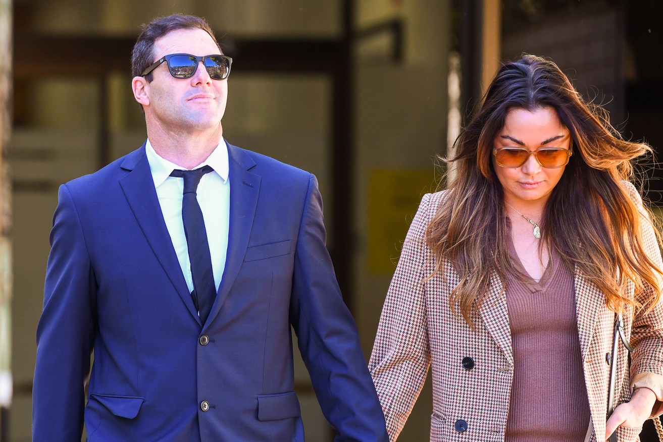Michael Gordon and wife Tess leave the Tweed Heads Local Court on the Gold Coast, Tuesday, August 2, 2022. The former Gold Coast Titans NRL specialist coach is on trial for his role in an alleged NSW-Qld border cocaine ring. (AAP Image/Jono Searle) 