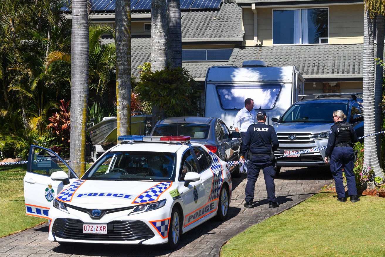 Police gather evidence where a woman’s body has been discovered in a house at Victoria Point. A man is being questioning over her death. (AAP Image/Jono Searle)