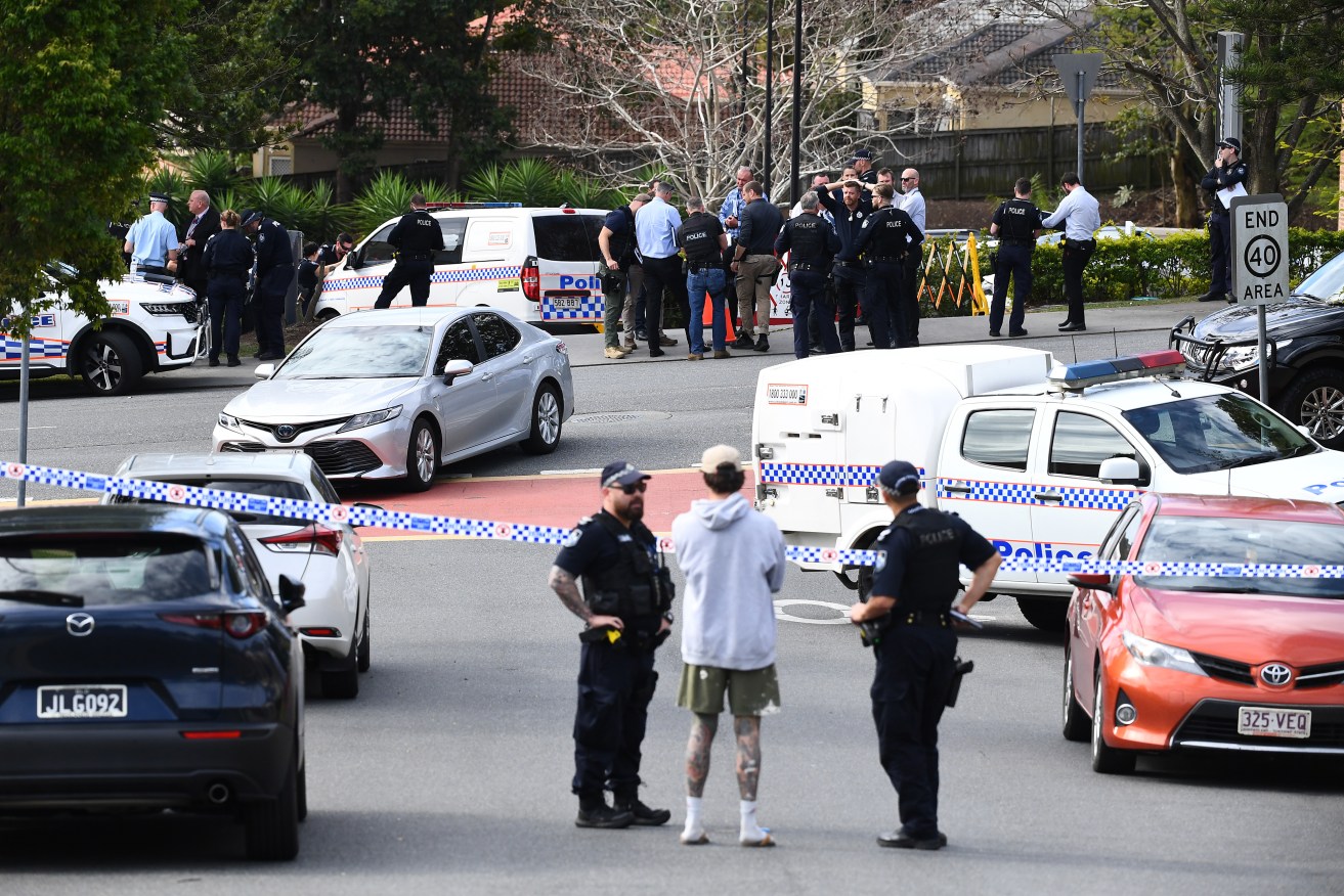 Police at the scene of a stabbing in a carpark at Carindale in Brisbane, Monday, September 12, 2022. A man has reportedly been stabbed to death in a car park outside a gym in Brisbane's southern suburbs. (AAP Image/Jono Searle) NO ARCHIVING
