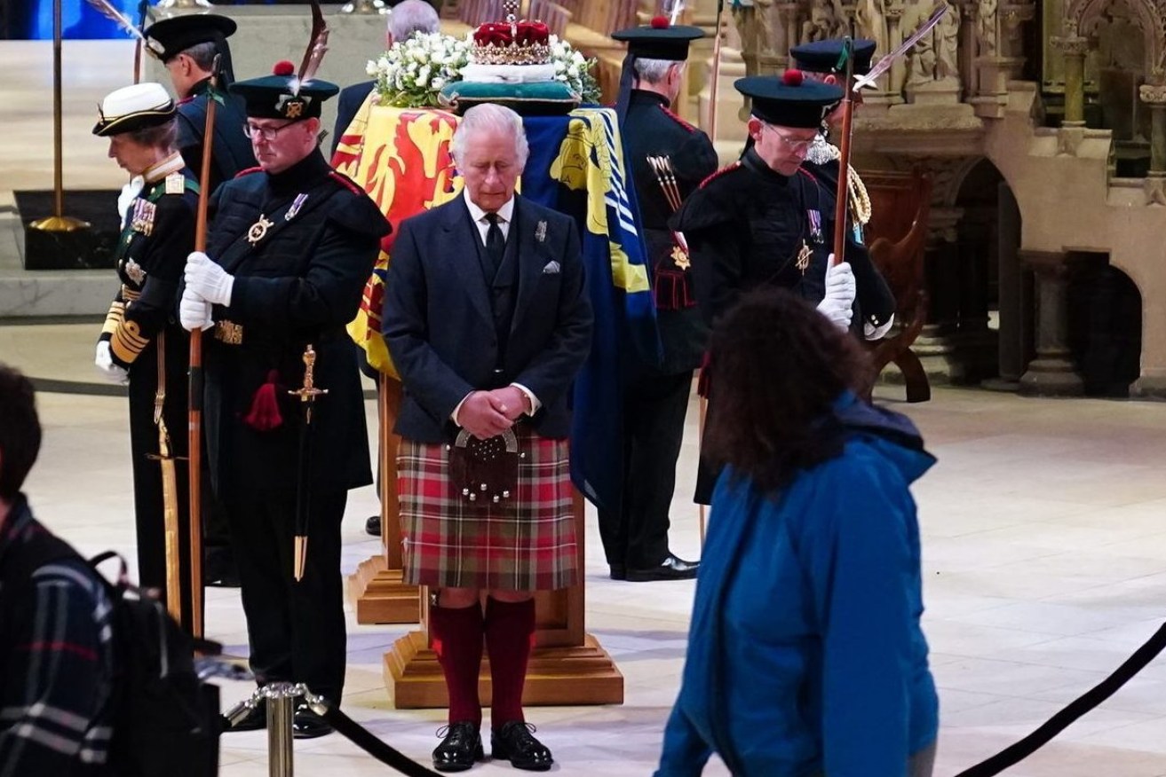  King Charles III, centre, and other members of the royal family hold a vigil at the coffin of Queen Elizabeth II at St Giles' Cathedral, Edinburgh, Scotland,  Monday Sept. 12, 2022, as members of the public walk past. (Jane Barlow/Pool via AP)