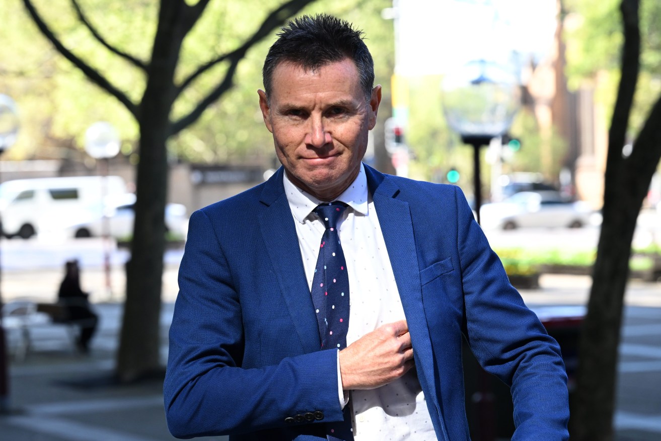 Former federal MP Dr Andrew Laming arrives at the The Federal Court. In settling a defamation case by Dr Andrew Laming, Nine has made a public apology for defaming the former politician by falsely reporting he took a lewd photo. (AAP Image/Dean Lewins) 