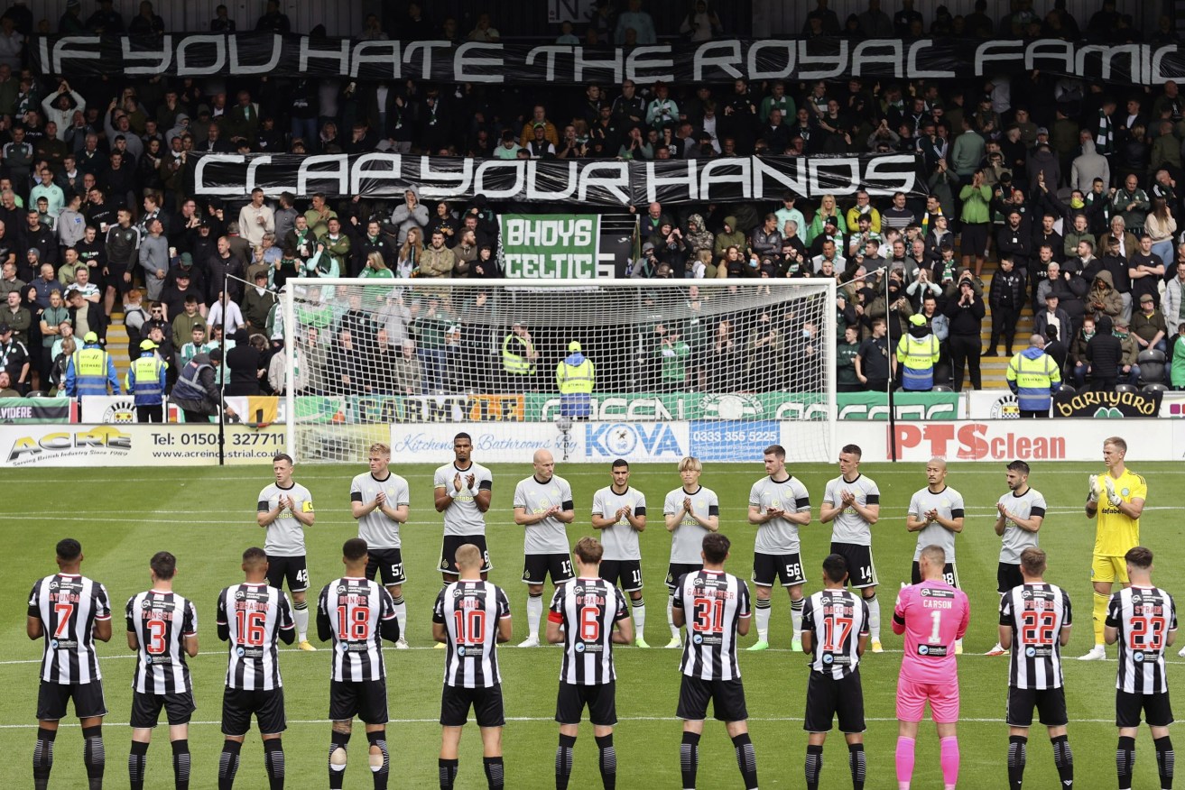Celtic fans hold up a banner before the cinch Premiership match between Celtic Glasgow and St Mirren at The SMISA Stadium, St Mirren, Britain, Sunday September 18, 2022. (Steve Welsh/PA via AP)