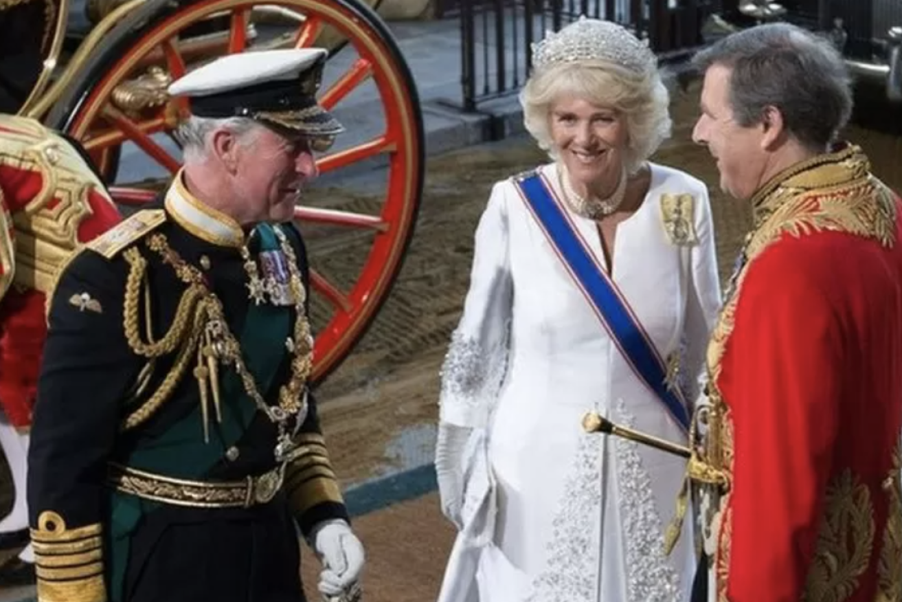 The Duke of Norfolk, pictured at right with King Charles and Queen Camilla, has been banned for driving for six months after using his mobile phone while at the wheel (Image: BBC)