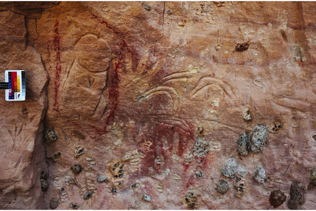 Part of the rock art site near Barcaldine showing a penis and boomerangs. (Photo: Supplied).