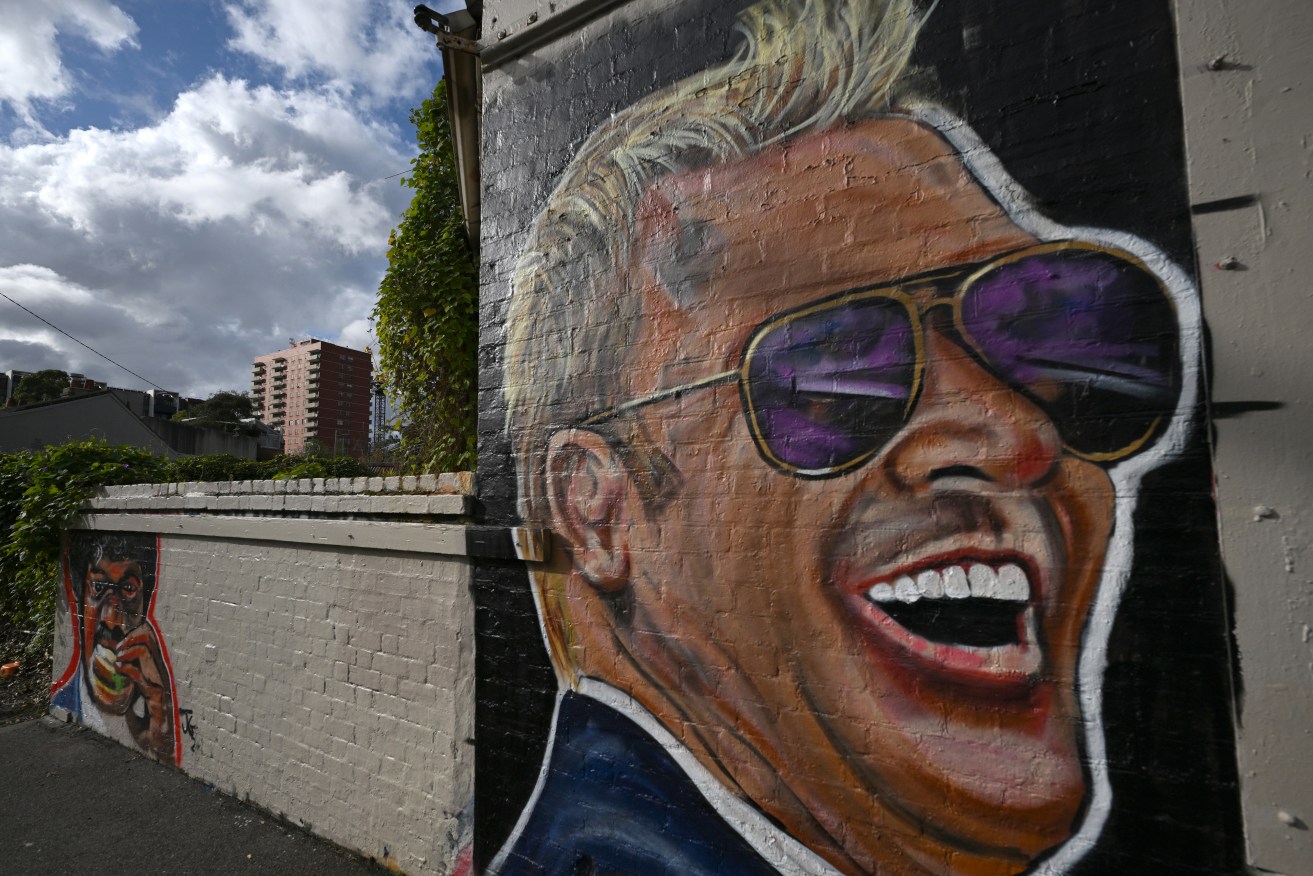 A mural featuring Australian cricketer Shane Warne by graffiti artist Jarrod Grech on the side of a house in the Melbourne suburb of Carlton. (AAP Image/Joel Carrett) 
