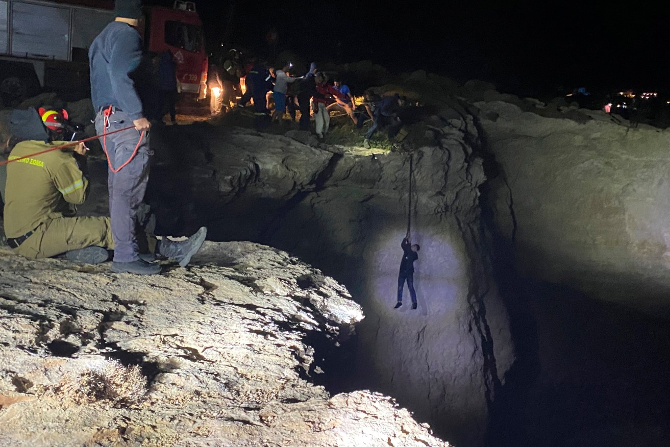 Authorities and local residents save a migrant during a large-scale rescue operation on the island of Kythira, some 225 kilometers south of Athens. (Ippolytos Prekas/kythera.news via AP)