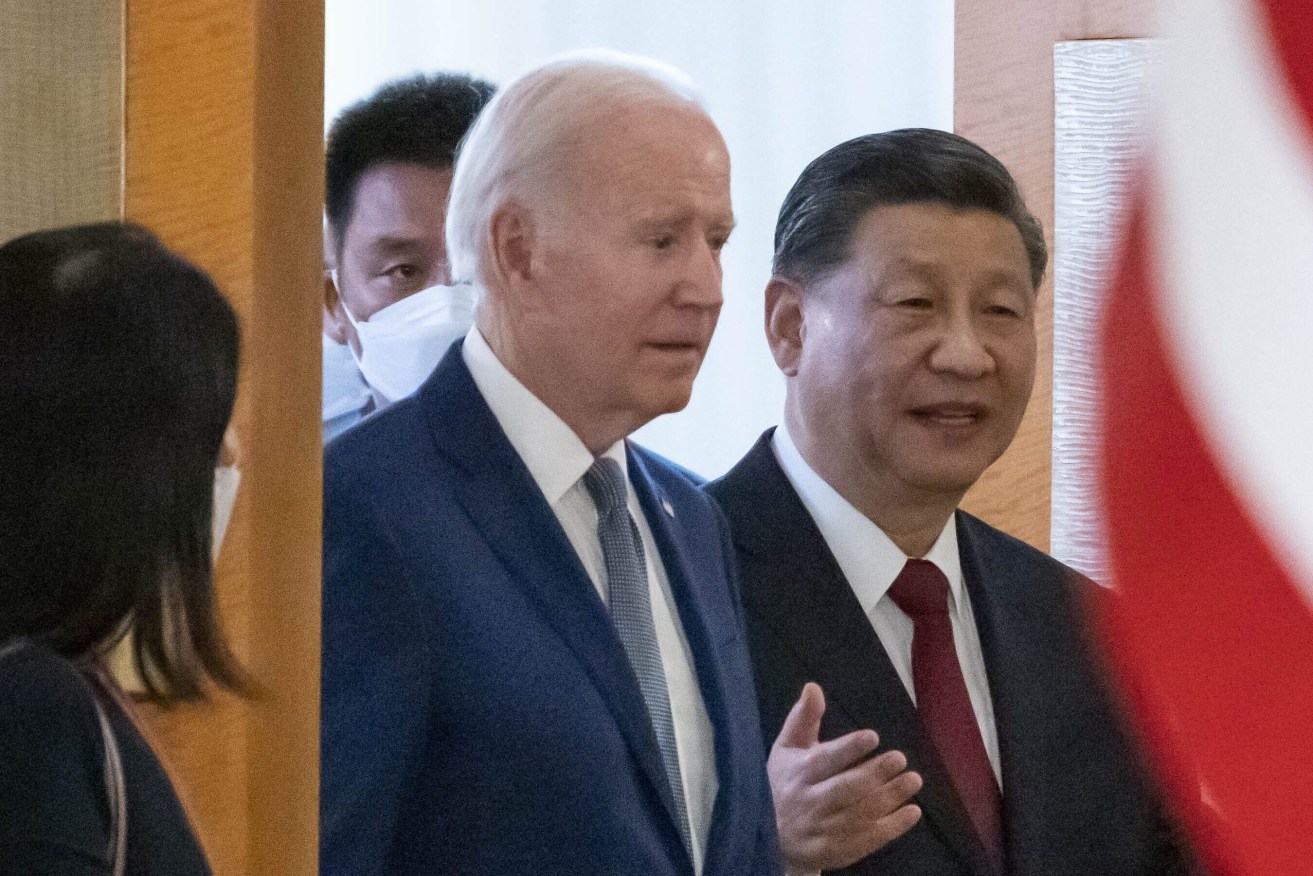 U.S. President Joe Biden, left, arrives with Chinese President Xi Jinping for a meeting on the sidelines of the G20 summit meeting in Bali, Indonesia. (AP Photo/Alex Brandon)