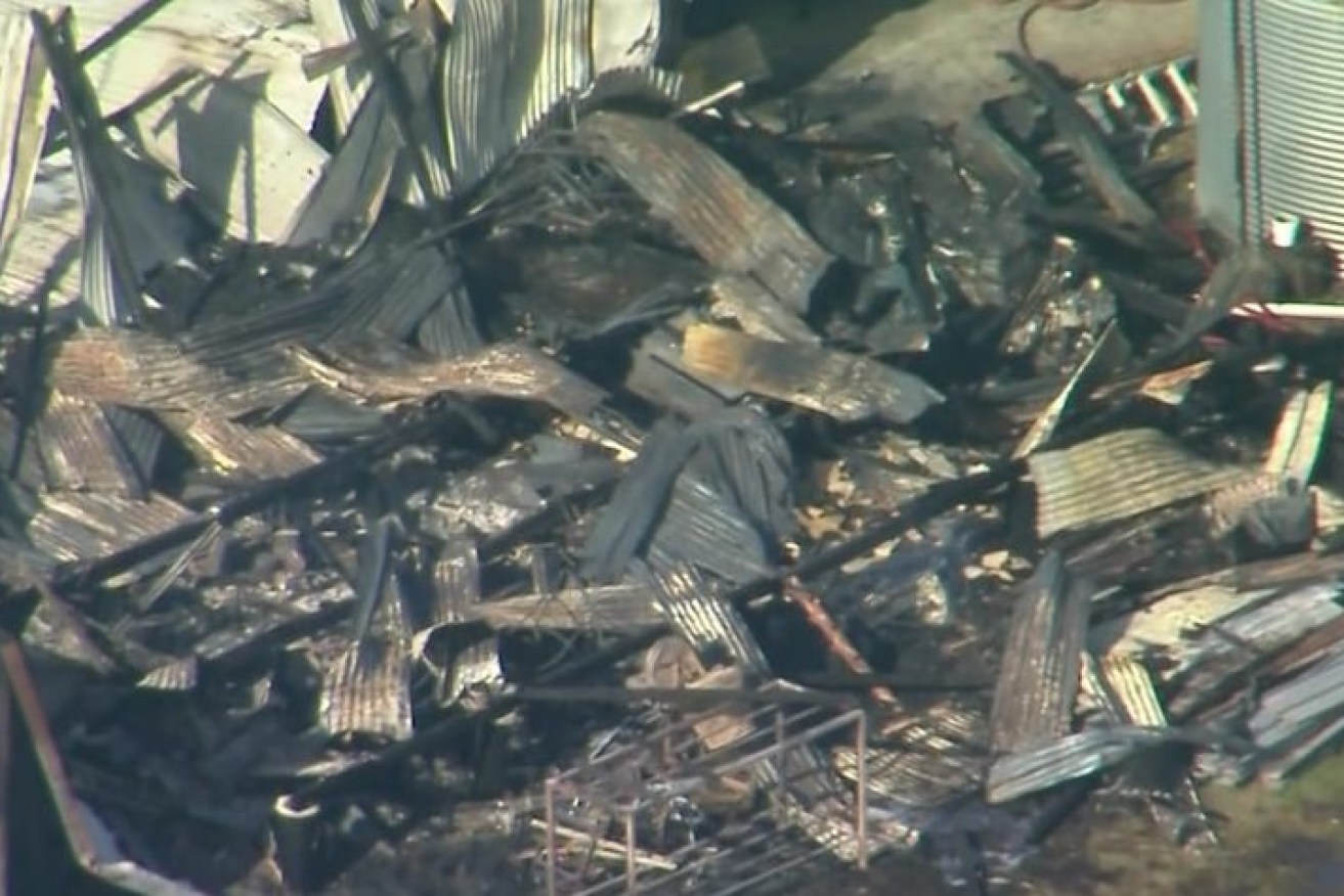 The burned out remains of the building in which two people are feared to have died. (ABC News image)