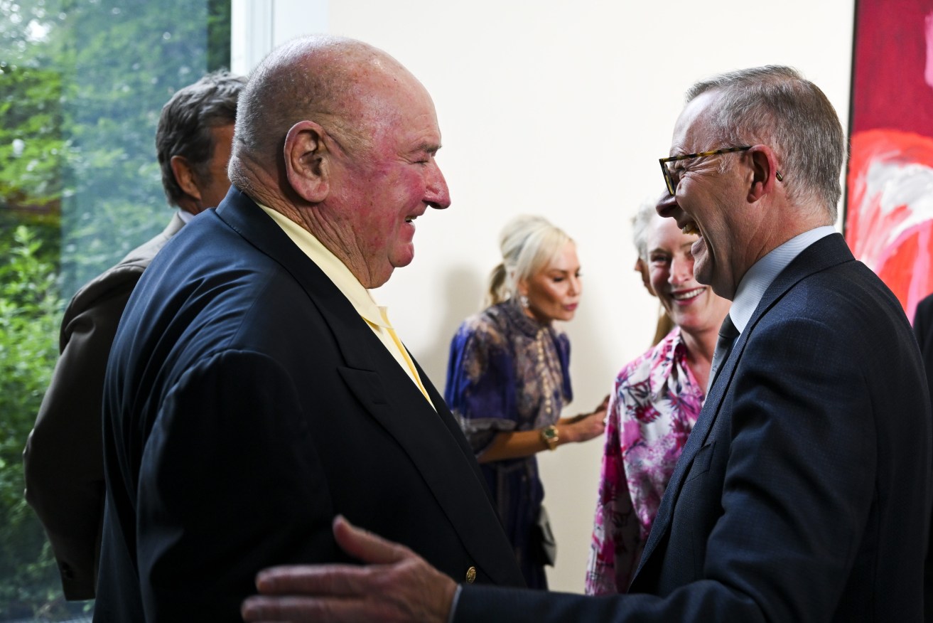 Austrlaian Prime Minister Anthony Albanese (right) speaks to Australian businessman Lindsay Fox as they attend the official opening of the exhibition of Aboriginal artist Mirdidingkingathi Juwarnda Sally Gabori at the Cartier Foundation in Parisn. (AAP Image/Lukas Coch) He is now under fire for attending a barbecue with the billionaire.