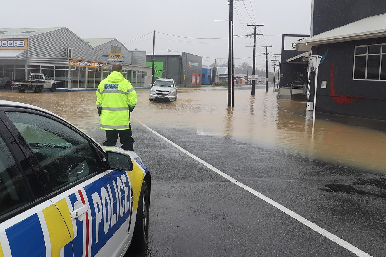NZ Finance Minister Grant Robinson said Cyclone Gabrielle would be "the biggest weather-related event this century and it will have a multi-billion dollar price tag". (AAP Image/Supplied by New Zealand Police) 