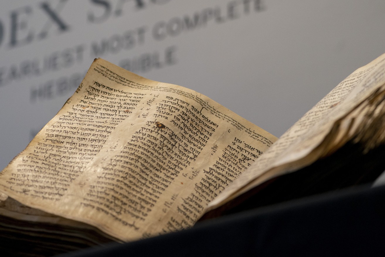 Sotheby's unveils the Codex Sassoon for auction, Wednesday, Feb. 15, 2023, in the Manhattan borough of New York. The auction house is billing the lot as the "earliest, most complete Hebrew Bible ever discovered." (AP Photo/John Minchillo)