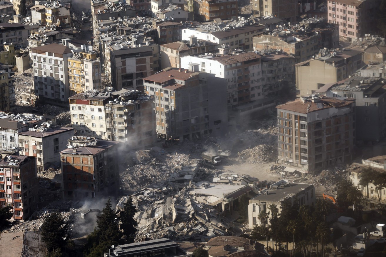 Ruins of a Turkish neighbourhood have been further destabilised by a fresh quake in Turkey overnight. (Clodagh Kilcoyne/Pool Photo via AP)
