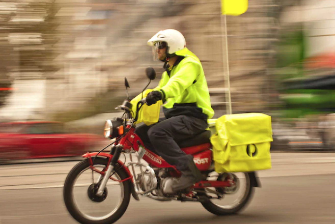 Australia Post has revealed plans to phase out petrol-powered motorbikes from its fleet within three years. (Image: ABC)