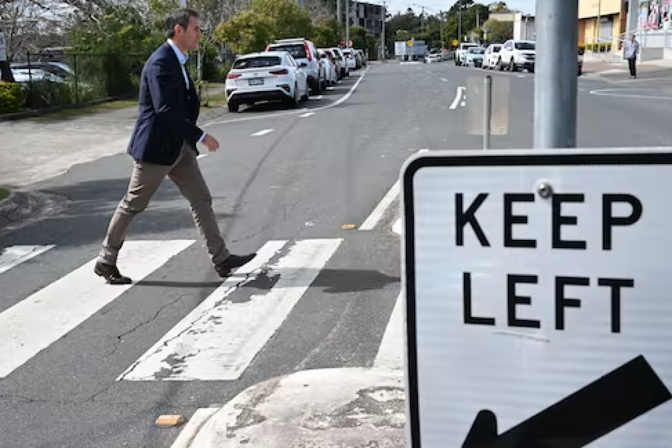 ederal Treasurer Jim Chalmers crossing the road outside the Logan Diggers Services Club in Logan, Queensland, August 2022. Glenn Campbell/AAP