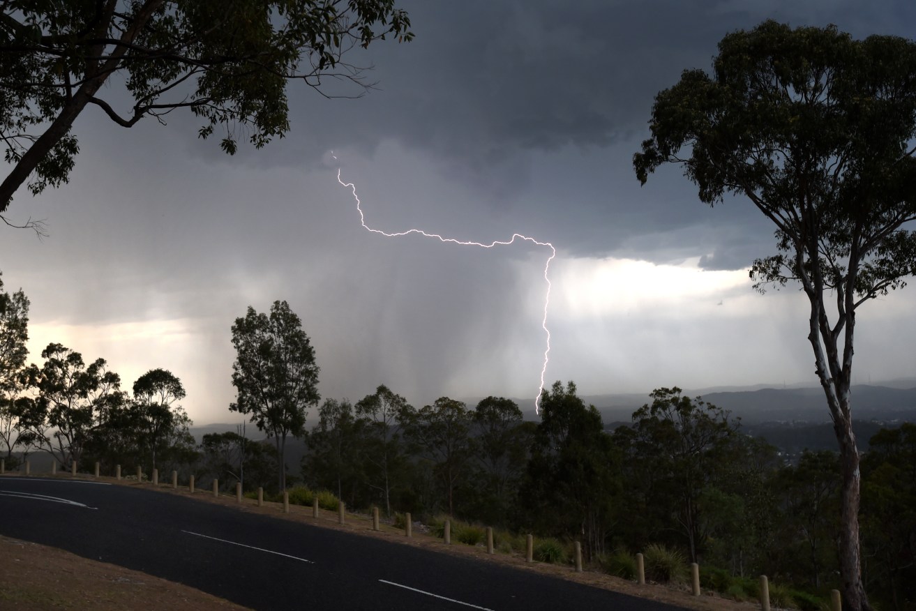 A Brisbane golfer is fighting for life after being struck by lightning while playing at Wantima Country Club. (AAP Image/Dan Peled) 