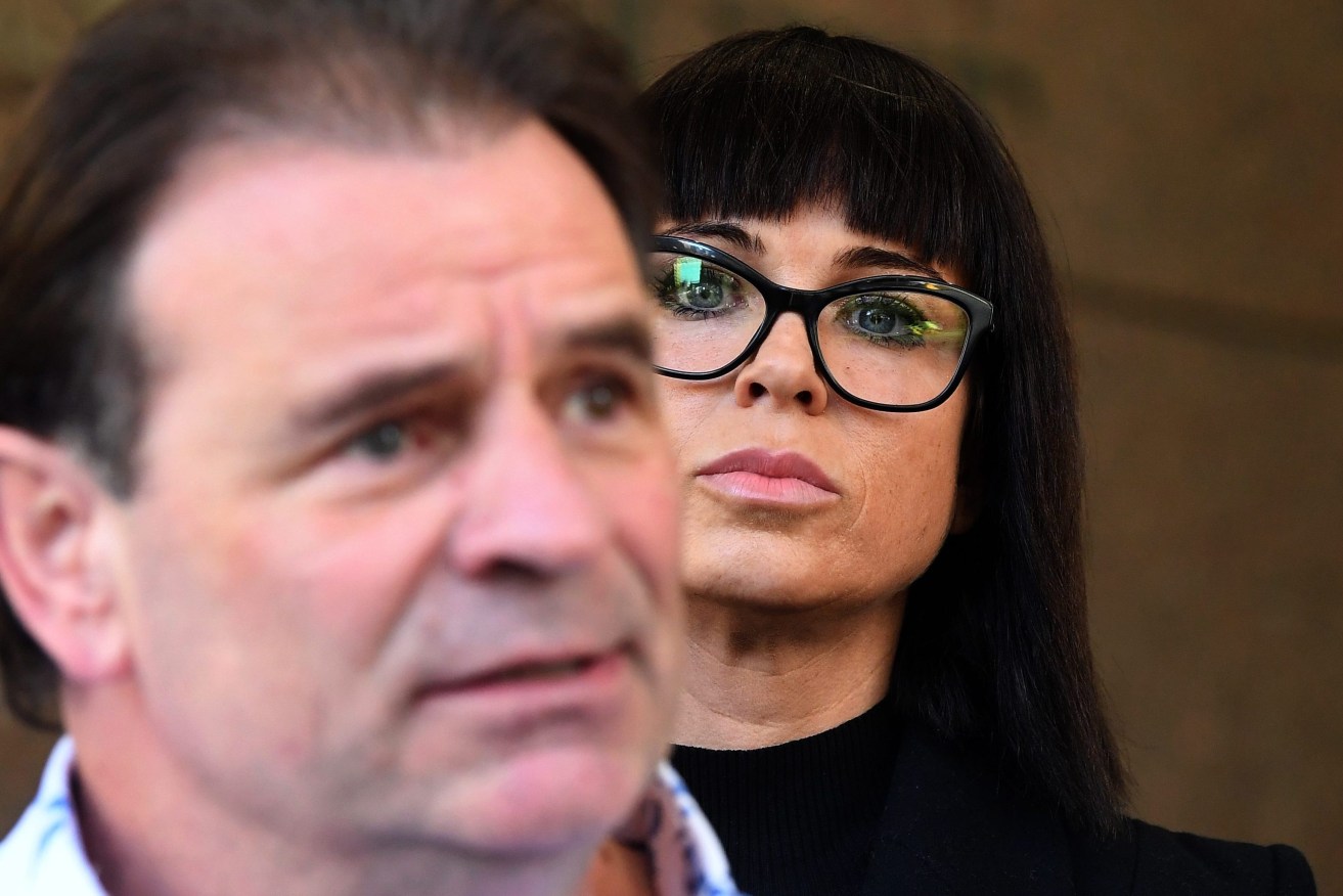 CFMMEU Victorian secretary John Sekta (left) and wife Emma Walters speak to the media outside the Melbourne Magistrates Court in Melbourne, Thursday, June 26, 2019. Walters is now charged with plotting his murder. (AAP Image/Julian Smith) 
