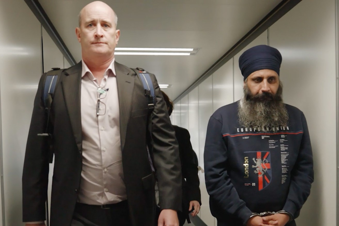 Rajwinder Singh (right), 38, arriving in Melbourne after he was extradited from India over his alleged involvement in the death of  Queensland woman Toyah Cordingley. (AAP Image/Supplied by QLD Police) 