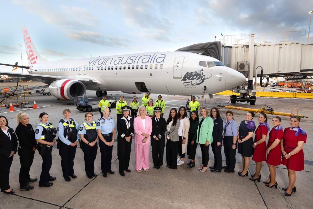 A supplied image shows the female team behind Virgin Australia flight VA313, which took to the skies on Wednesday in celebration of International Women's Day, at Melbourne Airport (AAP Image/Supplied by Virgin Australia, Fiona Hamilton) 