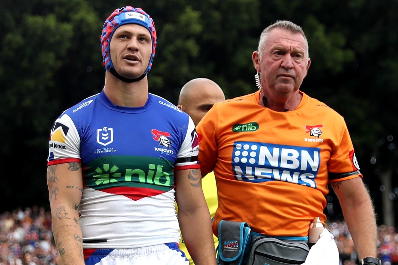Low point: Kalyn Ponga of the Newcastle Knights leaves the field at Leichhardt Oval for a HIA after his fourth concussion in 10 months. His comeback has culminated in him winning the Dally M Player of the Year.(AAP Image/Brendon Thorne) 