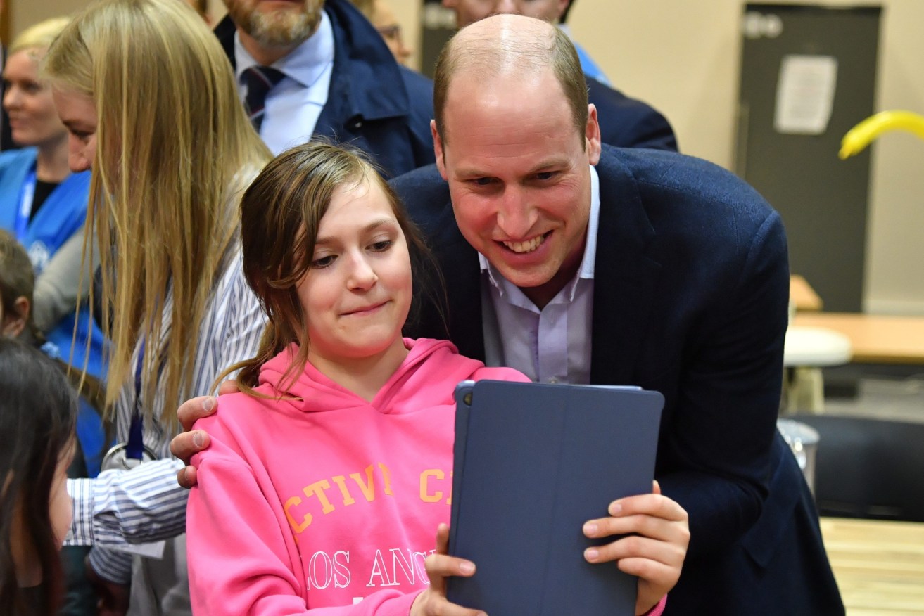 Britain's Prince William, the Prince of Wales chats with children during his visit to  refugees reception center for Ukrainians in Mokotow district in Warsaw, Poland. William is paying a surprise visit to Poland during which he met with Polish and British soldiers in Rzeszow and visited a refugee center for Ukrainians.  EPA/RADEK PIETRUSZKA 