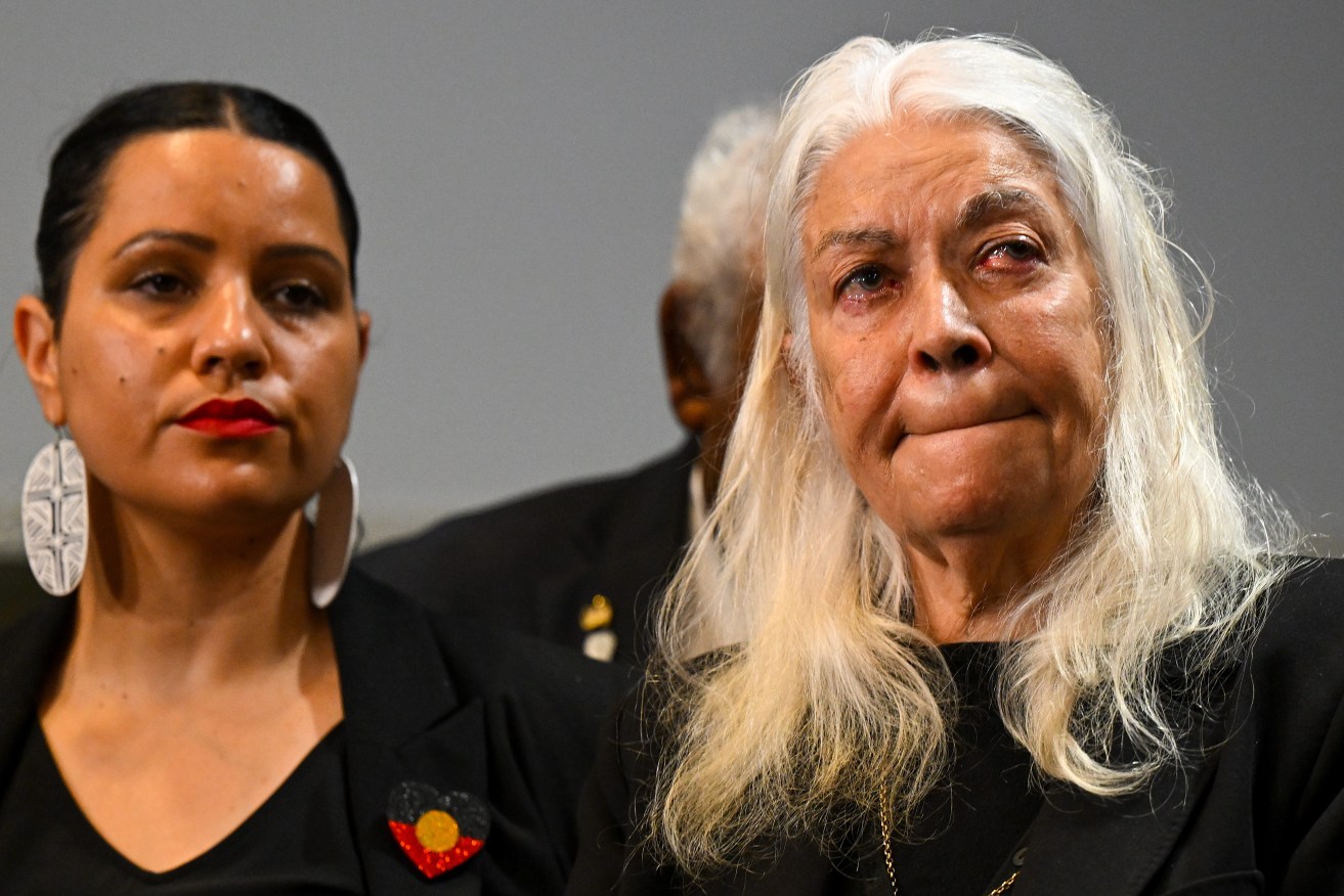 Member of the First Nations Referendum Working Group Marcia Langton (right) becomes emotional as she listens to Australian Prime Minister Anthony Albanese speak to the media. (AAP Image/Lukas Coch) 