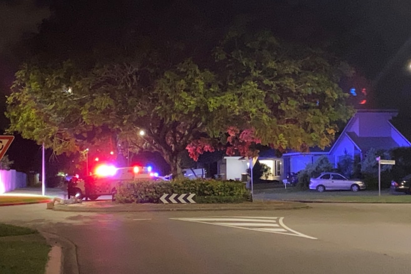 Police at the scene of the armed siege in Townsville overnight that ended wth the death of a man. (Image: ABC).