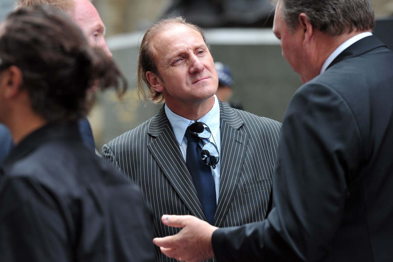 Gary Ablett senior attends the State funeral for Jim Stynes at St Paul's Cathedral in Melbourne. Ablett is suing the AFL for damages over head knocks he suffered when he was a player (AAP Image/POOL/Alex Coppel) 