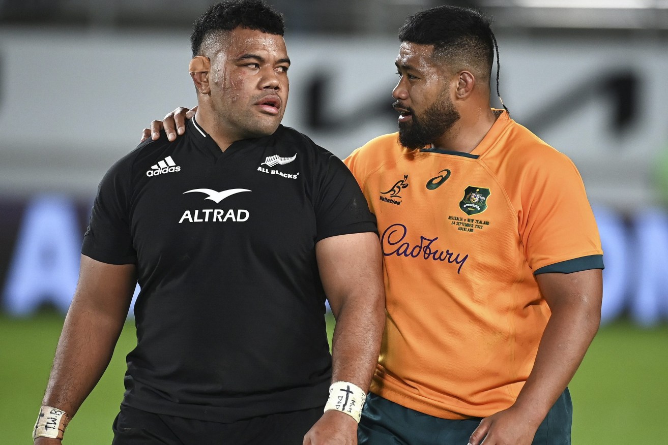 New Zealand's Samisoni Taukei'aho and Australia's Folau Fainga'a, right, chat following the Bledisloe Cup rugby test match between the All Blacks and the Wallabies at Eden Park in Auckland. (Andrew Cornaga/Photosport via AP)
