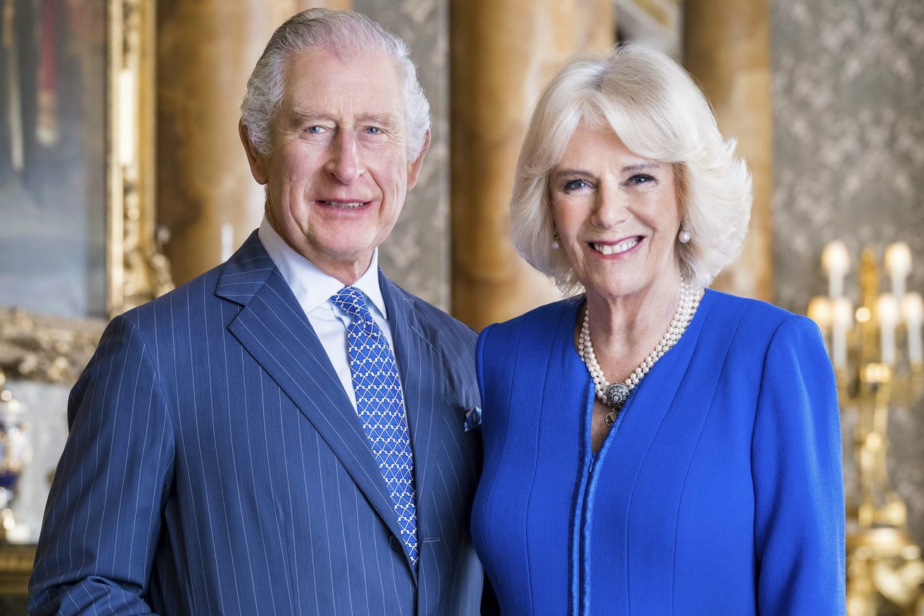 In this photo provided by Buckingham Palace on Tuesday, April 4, 2023, Britain's King Charles III and  Camilla, the Queen Consort pose for a photo in the Blue Drawing Room at Buckingham Palace, London. King Charles III’s wife has been officially identified as Queen Camilla for the first time, (Hugo Burnand/Buckingham Palace via AP)