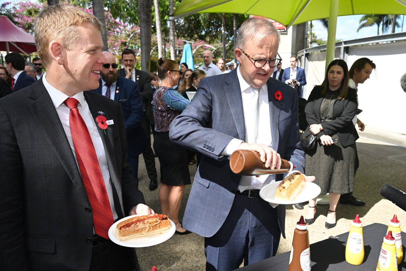 New Zealand Prime Minister Chris Hipkins (left) and Australian Prime Minister Anthony Albanese (right) are seen  at a BBQ after a Australian Citizenship Ceremony at South Bank Piazza during a visit to Brisbane, Sunday. (AAP Image/Darren England) 