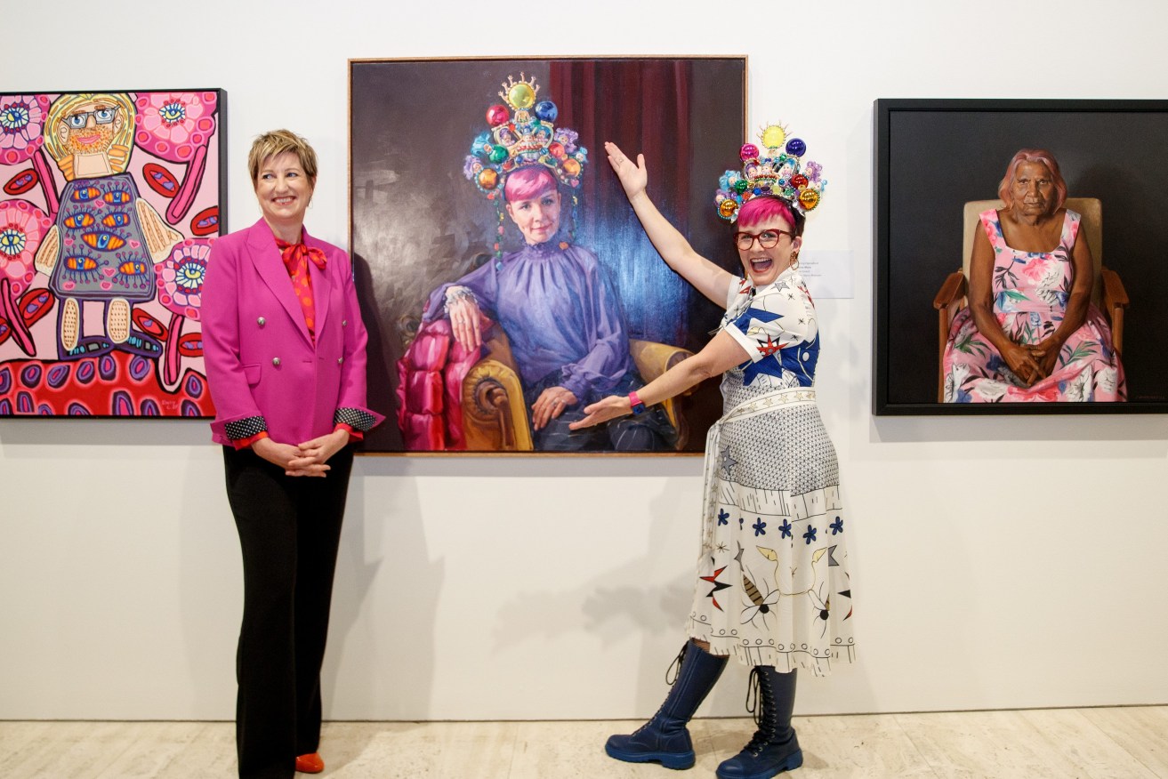 Artist Andrea Huelin and with comedian Cal Wilson and her Archibald Packing Room Prize portrait at the Art Gallery of NSW, Sydney Thursday, April 27, 2023.  (AAP Image/Nikki Short) 